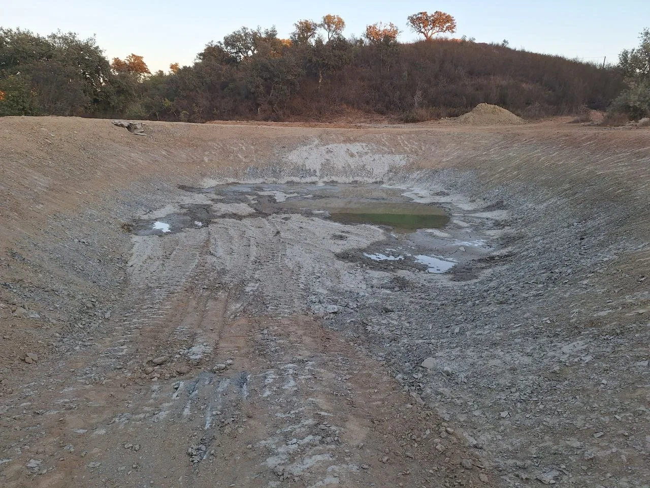 The lake basin on the day it was dug, with the first water at the bottom